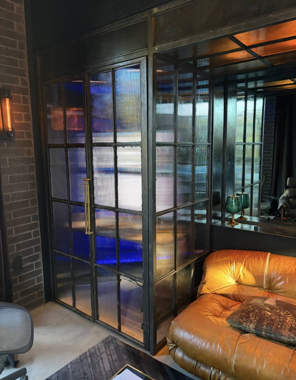 Steel double doors and partition glazed with reeded glass